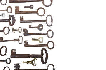 Different size old rusty keys  isolated on white background with copy space