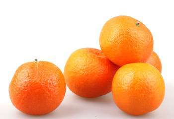 Fresh tangerine fruits on a white background