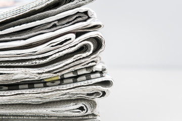 Newspapers folded and stacked