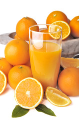 glass of orange juice with fruits on white background