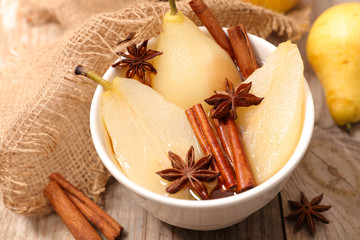poached pear with syrup and spices