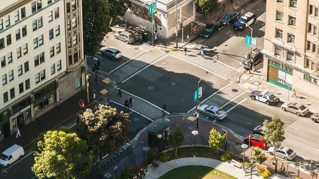 Time lapse view of people and traffic crossing busy intersection in San Francisco 