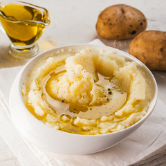 Mashed potatoes on white concrete background