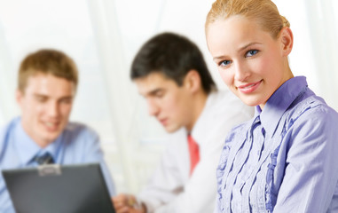 Fototapeta premium Three happy businesspeople working, isolated