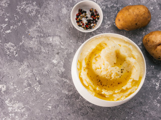 Mashed potatoes on gray concrete background