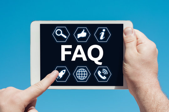 Man holding a tablet device showing frequently asked questions icons (FAQ)