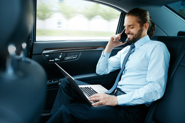 Business Man In Car Calling On Phone While Going To Work