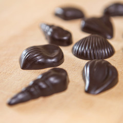 Homemade no sugar proper nutrition chocolate candies on a wooden background. Healthy food
