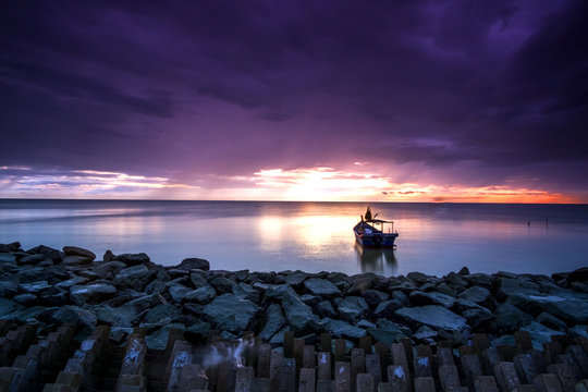 scenery of sunset at Penang,Malaysia. soft focus,motion blur due to long exposure. visible noise due to high iso.