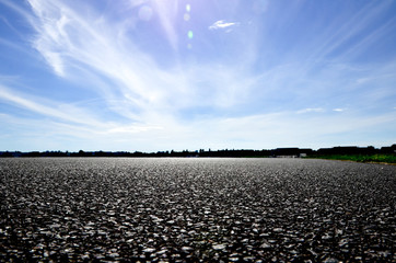 Rough asphalt road and sky cloud scenery © Knut Hebstreit