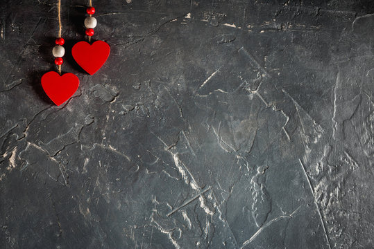 Hearts on Valentine's Day on fir and concrete background with space and empty place
