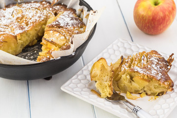 Fresh baked cardamom cognac apple cake in iron skillet.