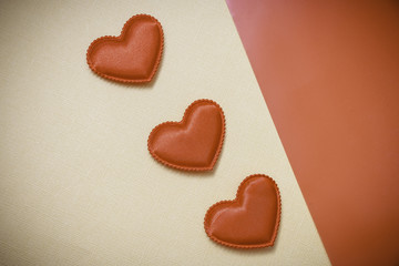 three hearts on a yellow background