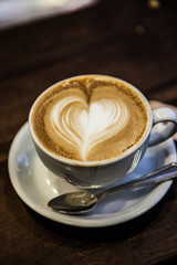 Heart-shaped coffee art on espresso hot beverage
