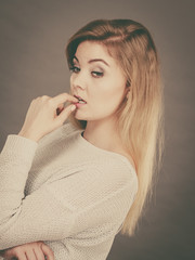 Blonde woman contemplating thinking about something