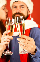 Santa and sexy girl with drinks, closeup. Man with beard