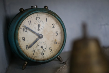 Old dusty analog table clock