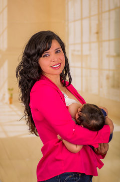Mother breastfeeding her baby. Healthy lifestyle concept