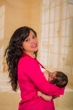 Mother breastfeeding her baby. Healthy lifestyle concept