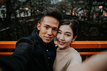 Young japanese couple spending time together in Tokyo