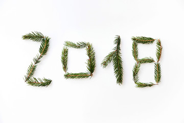 Number of new year 2018 made of fir branches. Flat lay, top view