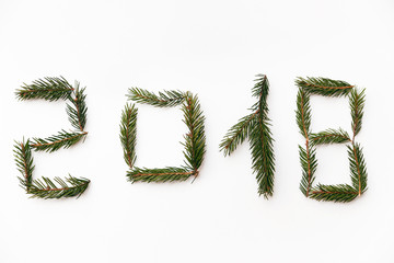 Christmas composition. Christmas gift, 2018 made of fir branches. Flat lay, top view