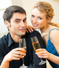 Cheerful couple with champagne