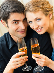Cheerful couple with champagne