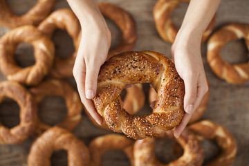 Woman hand holding turkish bagel