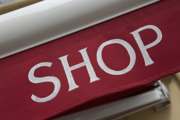 Obraz premium Red and White Shop Sign