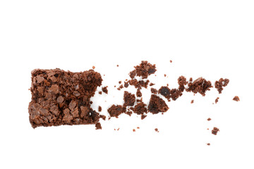 Brownie and crumbs on a white background