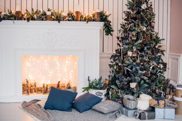 Christmas background with illuminated fir tree and fireplace at house