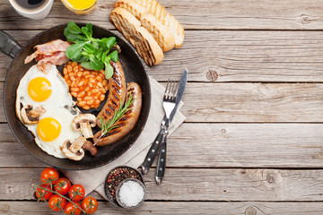 English breakfast. Fried eggs, sausages, bacon