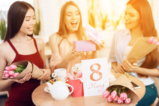 Three girls celebrate the holiday on March 8.