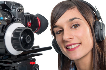 Obraz na płótnie Canvas beautiful young woman with DSLR video camera