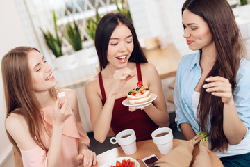 Three girls celebrate the holiday on March 8.