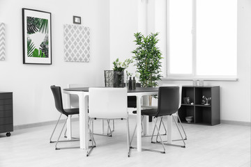 Modern room interior with big table and chairs