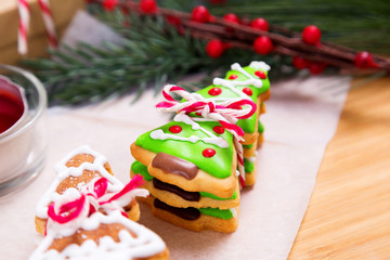 Christmas homemade gingerbread cookies on wooden table