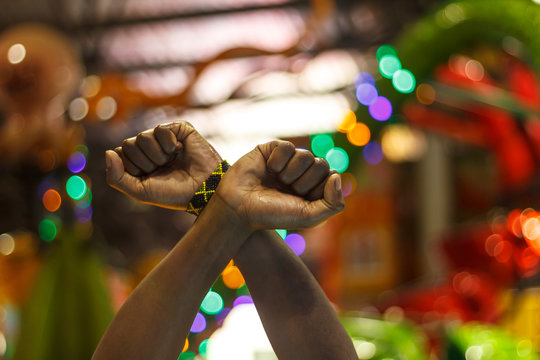 Fists crossed in a sign of protest or defiance