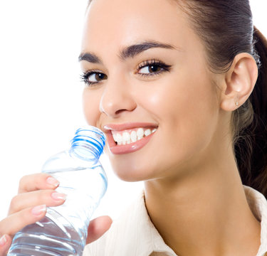 Young woman drinking water, isolated over white