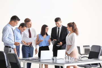 Team of young consulting experts on business meeting in office