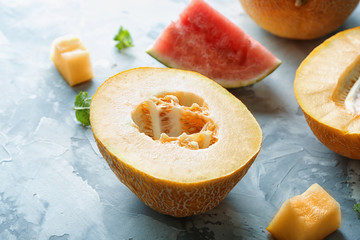 Yummy cut melon on grey background