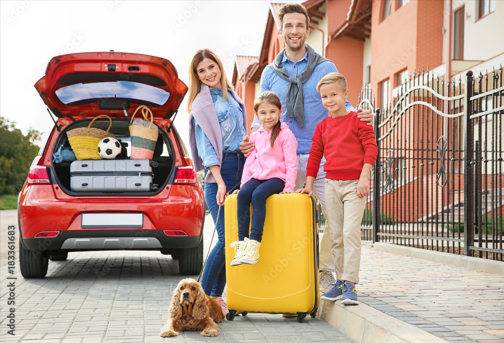 Poster young family with children and dog near car