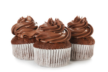 Delicious chocolate cupcakes on white background