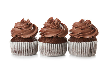 Delicious chocolate cupcakes on white background