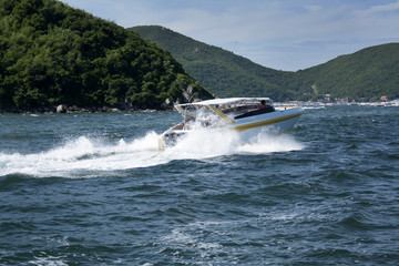 Fototapeta premium Summer photo of the sea, yacht and islands in the background. Tropical island. Vacations in the summer.