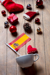 White cup and Spain flag with Christmas decoration