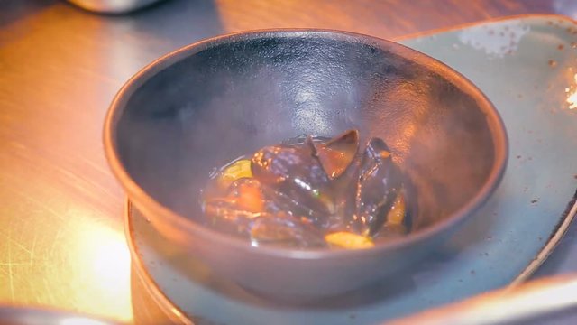 Cooking mussels in seafood asian restaurant