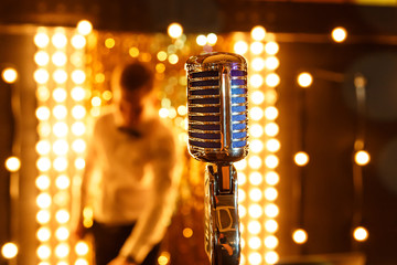 Microphone. Retro microphone. A microphone on stage. A pub. Bar. Restaurant.