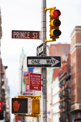 A one way sign and a traffic light in Ney York City, NYC
